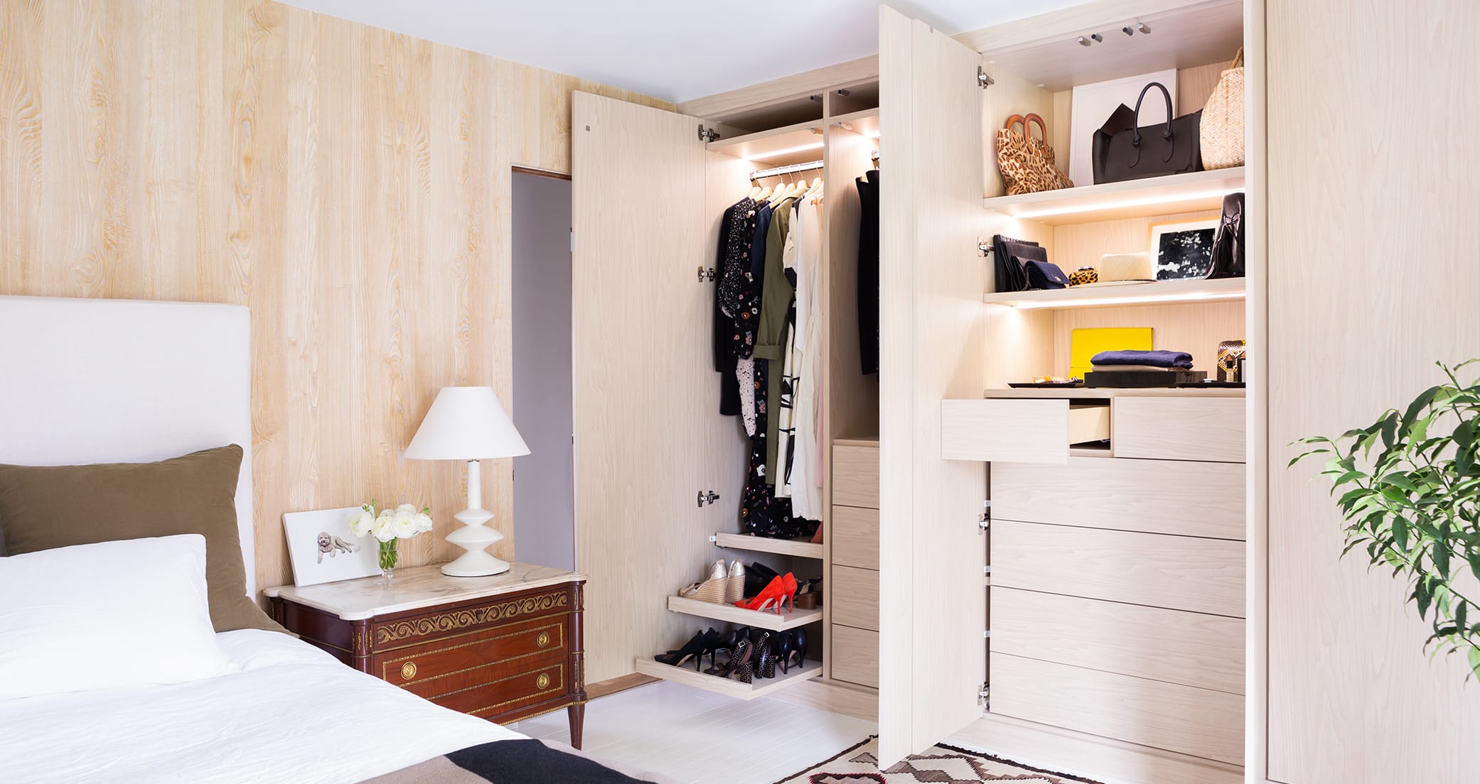 Customized reach in closets side by side design with built-in dresser drawers and shoe storage by California Closets