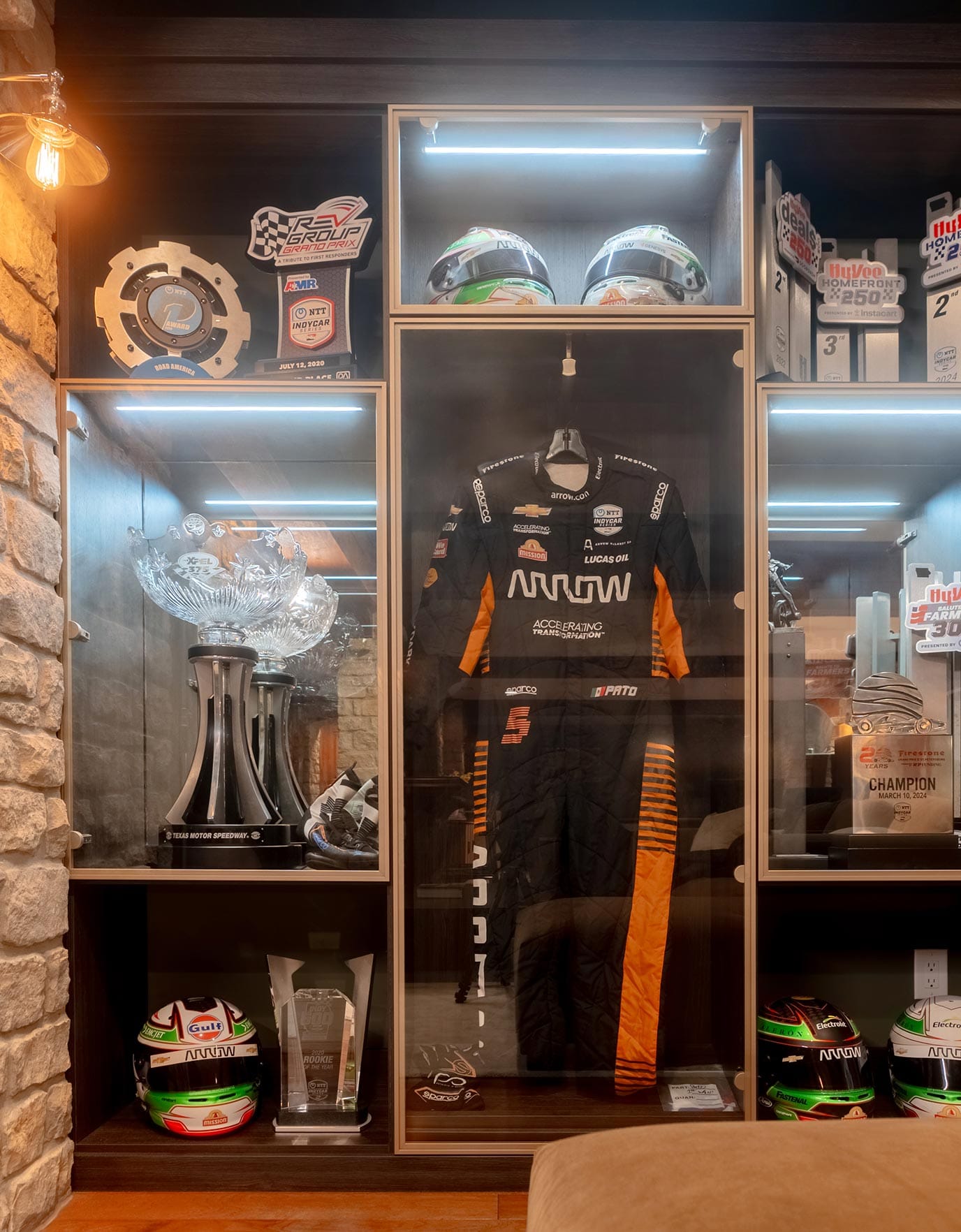 Custom-built display to showcase Pato O'Ward's car racing gear and trophies created by California Closets Indianapolis