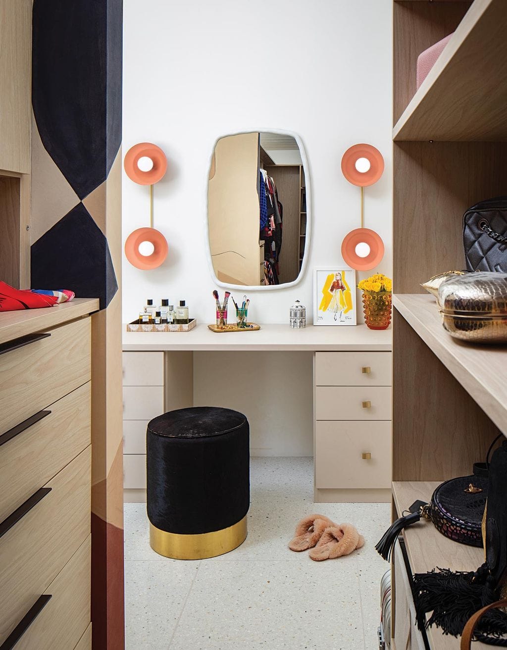 The after closet redesigned for Ace Harper with built in vanity created by California Closets