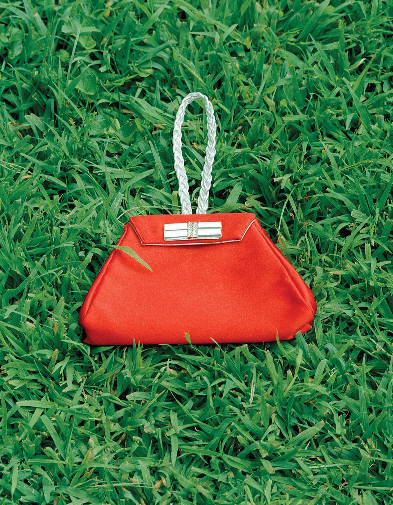 A red designer handbag that belonged to Ellie Montgomery Atuk in Atlanta society in Ideas of Order Magazine